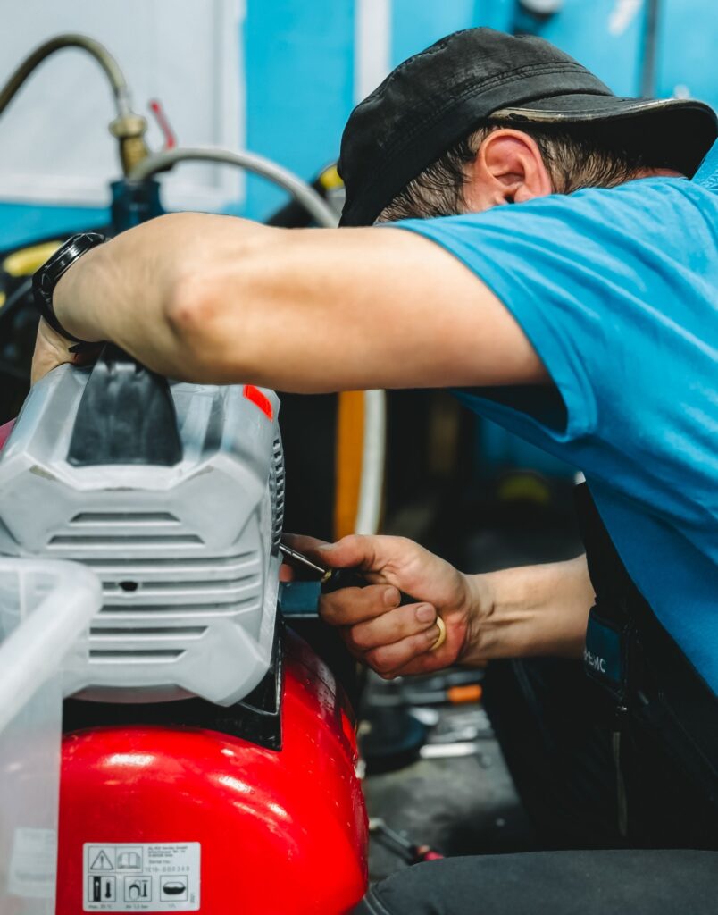 Engineer carrying out a dental compressor service inspection — annual compressor servicing for dental practices - Copy